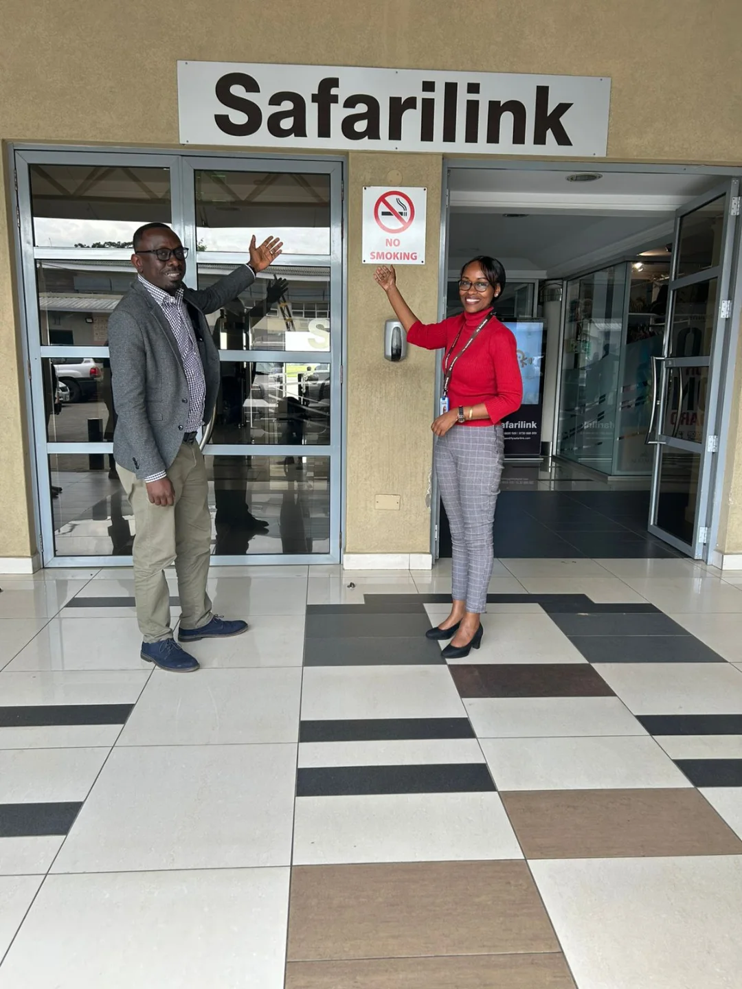 Safarilink staff welcoming guests at the terminal entrance